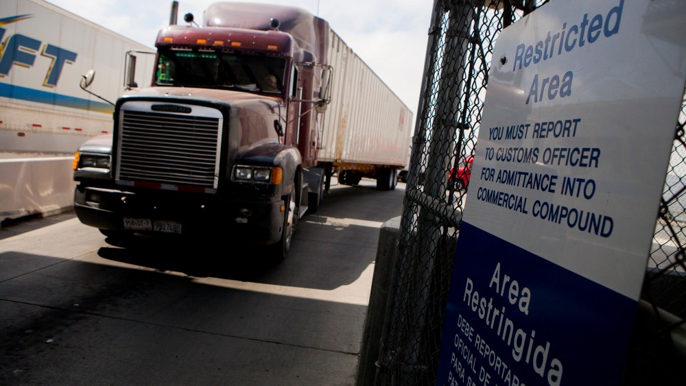 Truck drivers wait to speak to a US Customs and Border Protection officer soon after arriving in the US from Mexico at the Otay Mesa Port of Entry cargo facility in San Diego, Calif., June 7, 2013. (Photo by Sam Hodgson/Bloomberg via Getty)