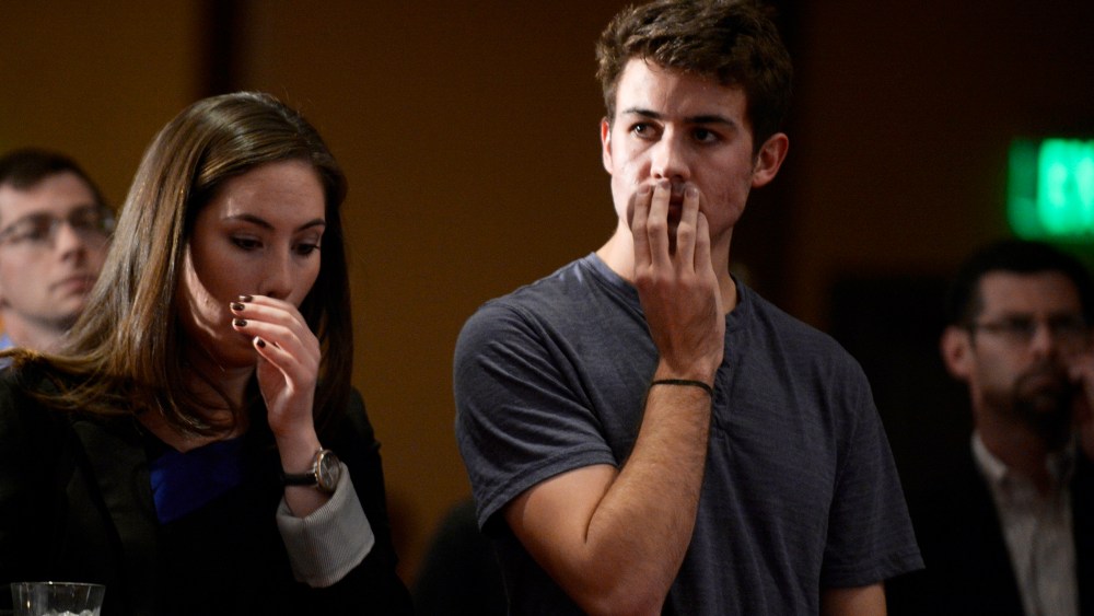 Campaign volunteer Dylan Saunders, right, listens to comments by Sen. Mike Johnston during a watch party for supporters of Amendment 66 at the Marriott City Center in Denver, CO November 05, 2013.