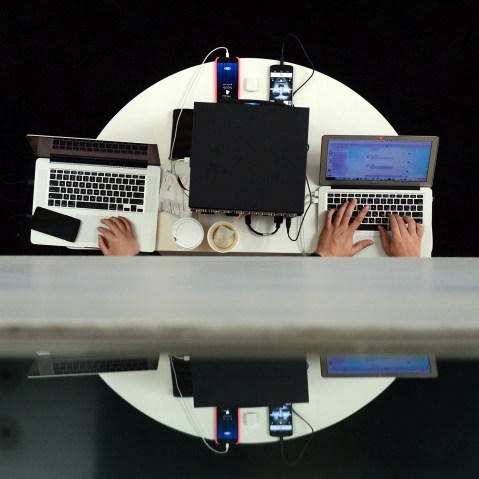 Users type on laptop computers during an event in Los Angeles, Calif., on Nov. 18, 2014. (Photo by Frederic J. Brown/AFP/Getty)