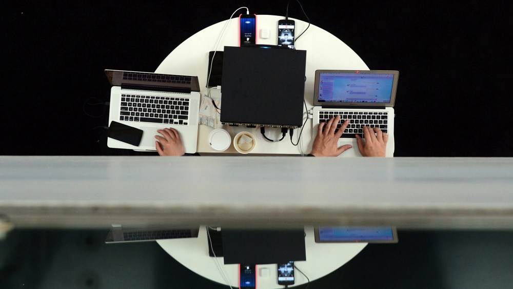 Users type on laptop computers during an event in Los Angeles, Calif., on Nov. 18, 2014. (Photo by Frederic J. Brown/AFP/Getty)