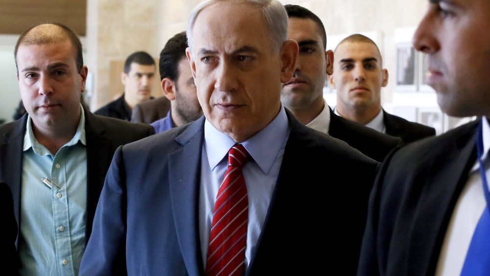 Surrounded by bodyguards, Israeli Prime Minister Benjamin Netanyahu arrives to the Likud faction meeting at the Knesset (Israel's Parliament) on Dec. 3, 2014 in Jerusalem. (Photo by Gali Tibbon/AFP/Getty)