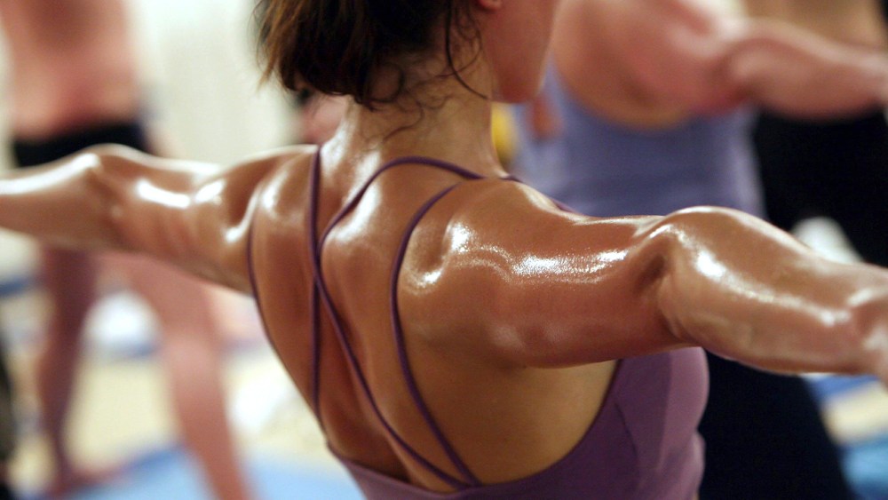 Students practice the unique Bikram Yoga at the City Studio, on March 13, 2007 in London, England. (Photo by Matt Cardy/Getty)