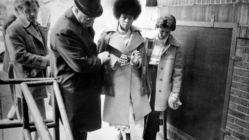 JoAnne Chesimard is taken chained handcuffs and leg irons from Riker's Island prison in New York City to the Middlesex County jail to await trail in the murder of state trooper Werner Foerster. (Photo by Frank Hurley/NY Daily News Archive/Getty)