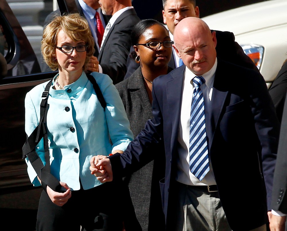 File Photo: Former Democratic Rep. Gabrielle Giffords, left, and her husband Mark Kelly leave after the sentencing of Jared Loughner, in back of U.S. District Court Thursday, Nov. 8, 2012, in Tucson, Ariz. Giffords and Kelly launched a political action...
