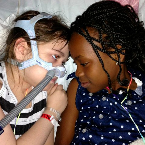 In this May 30, 2013 photo provided by the Murnaghan family, Sarah Murnaghan, left, lies in her hospital bed next to adopted sister Ella on the 100th day of her stay in Children's Hospital of Philadelphia. The 10-year-old suburban Philadelphia girl has...