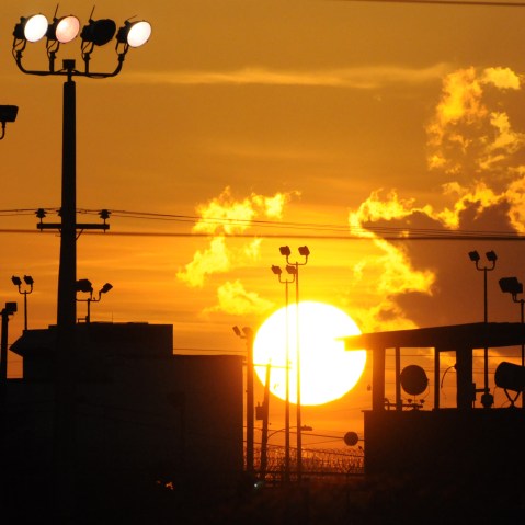 In this photo reviewed by the U.S. Department of Defense, towers overlooking a U.S. detention facility are silhouetted against a morning sunrise at Guantanamo Bay U.S. Naval Base, Cuba, Thursday, Oct. 18, 2012.  (AP Photo/Toronto Star, Michelle...