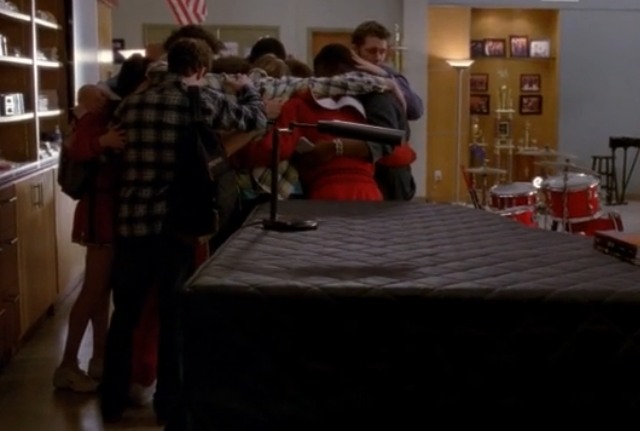 This screencap from the April 11, 2013 episode of "Glee" shows students hugging after gun shots were fired in their school.