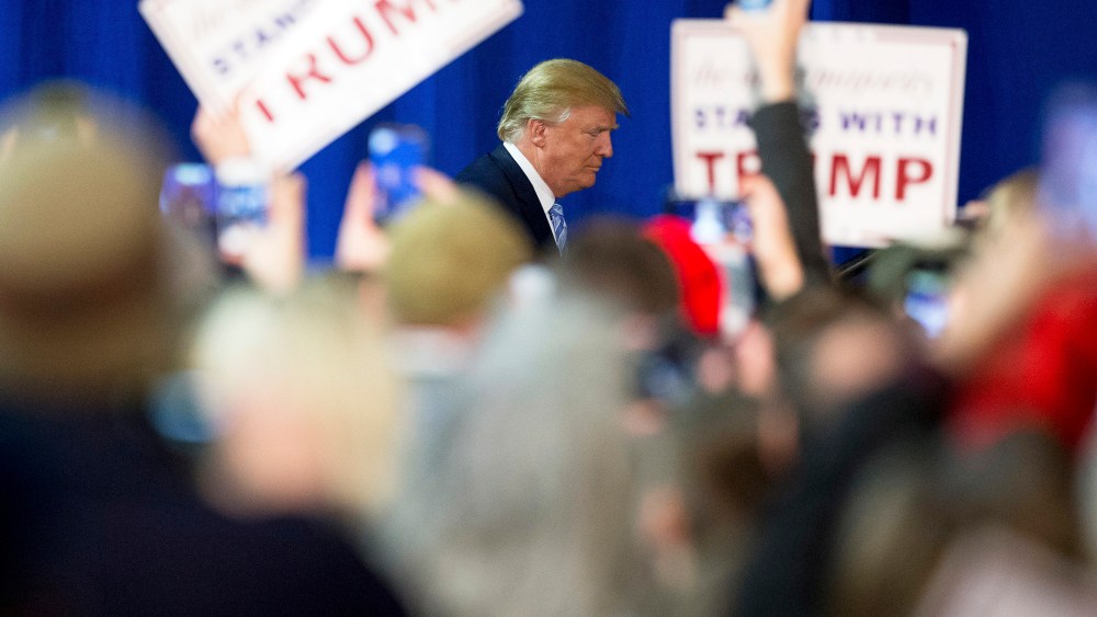 Republican presidential candidate Donald Trump arrives to speak at a rally at Muscatine High School in Muscatine, Iowa, Jan. 24, 2016. (Photo by Andrew Harnik/AP)