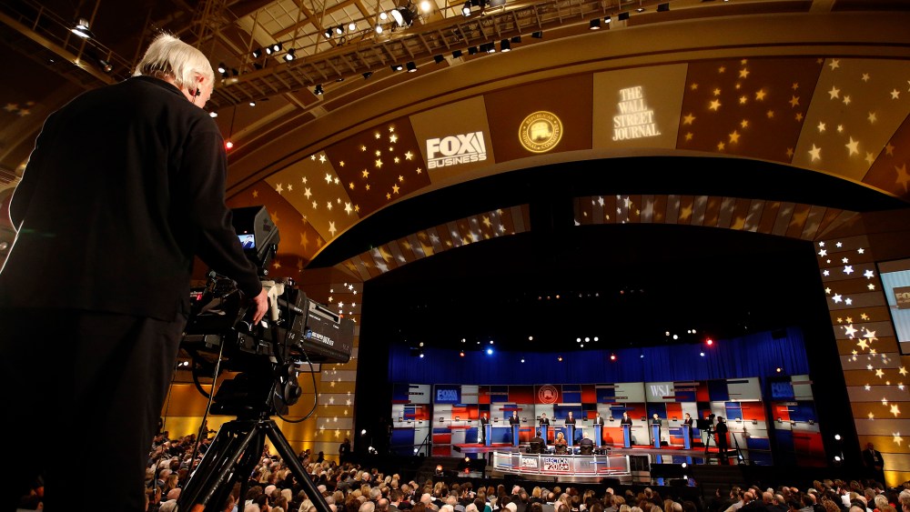 A cameraman films the top Republican presidential candidates during Republican presidential debate at Milwaukee Theatre, Nov. 10, 2015, in Milwaukee, Wis. (Photo by Morry Gash/AP)