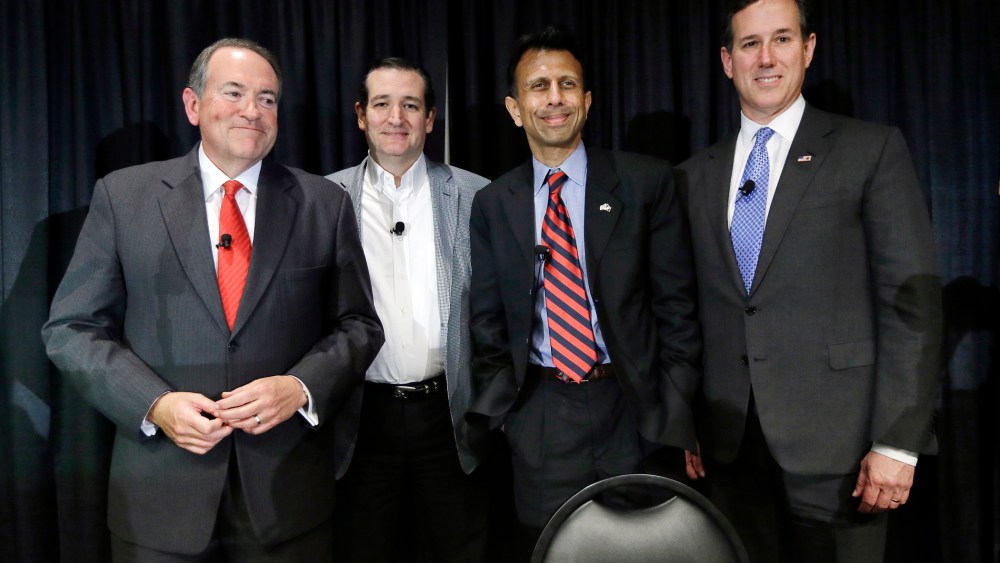 Former Arkansas Gov. Mike Huckabee, from left, Sen. Ted Cruz, R-Texas, Louisiana Gov. Bobby Jindal and former Pennsylvania Sen. Rick Santorum gather on stage after speak at the Homeschool Iowa's Capitol Day, Thursday, April 9, 2015, in Des Moines, Iowa.