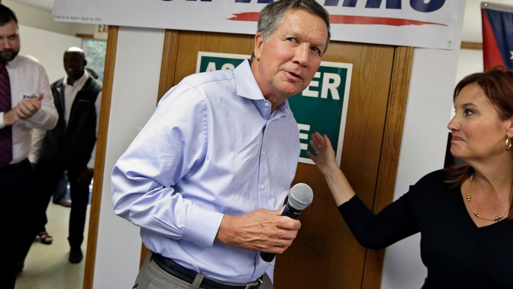 Ohio Gov. John Kasich is introduced by Lt. Gov. Mary Taylor during a rally at Darke County GOP headquarters, on Oct. 13, 2014, in Greenville, Ohio.