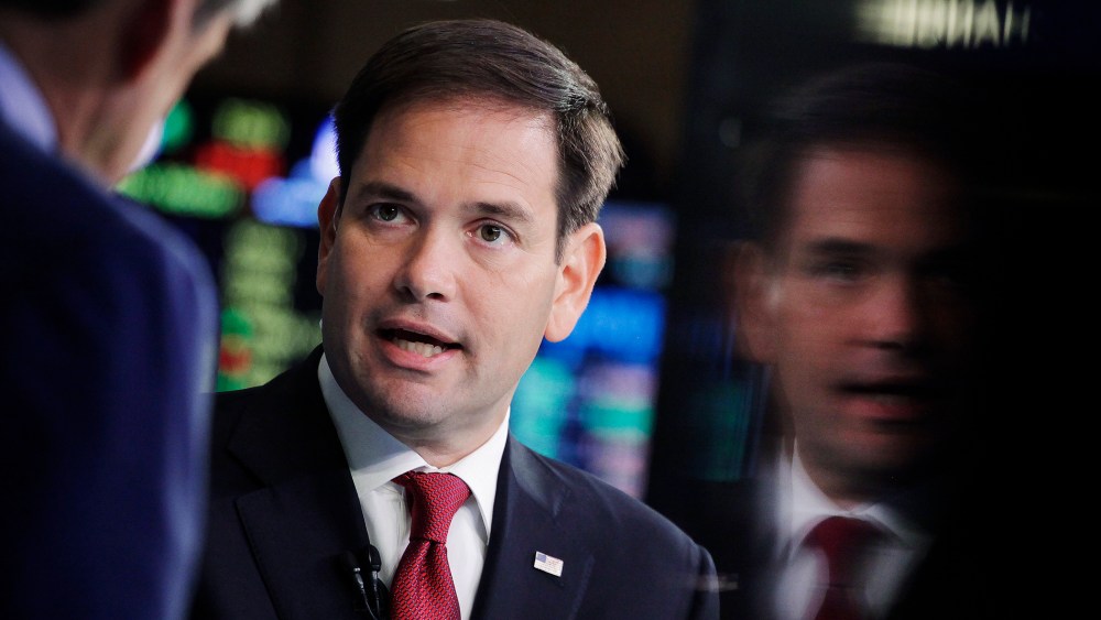 Republican presidential candidate, Sen. Marco Rubio, R-Fla., talks to CNBC correspondent John Harwood, left, during an interview at the New York Stock Exchange, Oct. 5, 2015. (Photo by Mark Lennihan/AP)