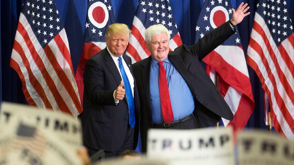 Republican presidential candidate Donald Trump, left, and former House Speaker Newt Gingrich, right, acknowledge the crowd during a campaign rally at the Sharonville Convention Center, July 6, 2016, in Cincinnati. (Photo by John Minchillo/AP)
