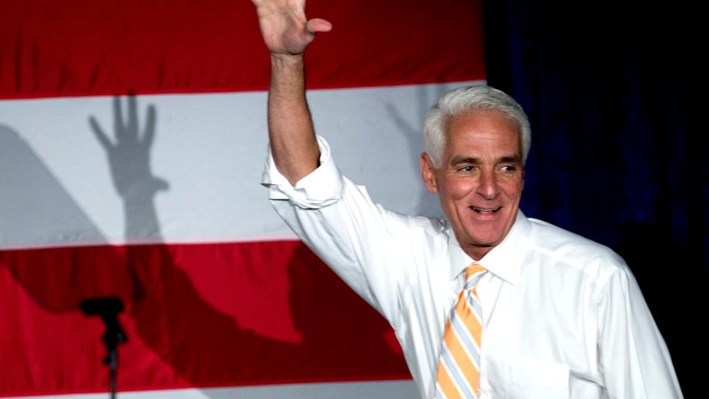 Former Florida Republican Gov. Charlie Crist, now running as a Democrat, waves to supporters during a campaign event, on Oct. 17, 2014, in Miami Gardens, Fla.