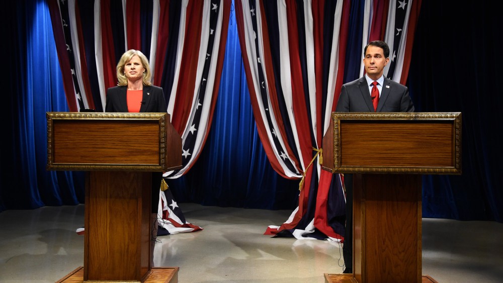 Wisconsin Republican Governor Scott Walker, right, and Democratic challenger Mary Burke, left, prepare for a televised debate on Oct. 17, 2014 in Milwaukee, Wis.