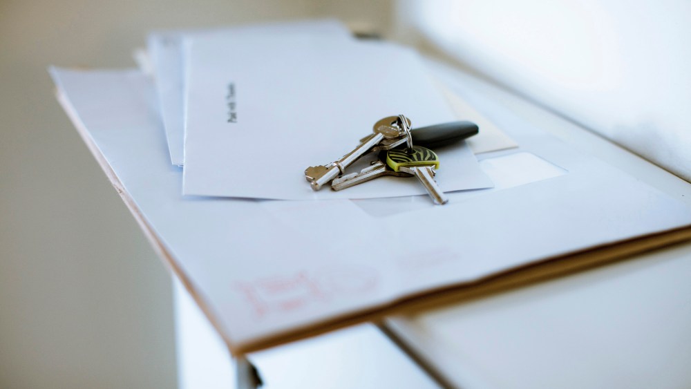 Keys on top of letters are seen in a home. (Photo by Trevor Hart/Gallery Stock)