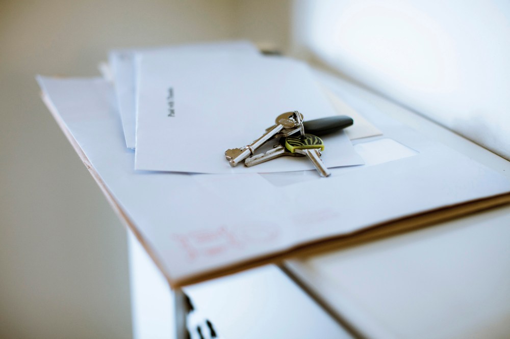 Keys on top of letters are seen in a home. (Photo by Trevor Hart/Gallery Stock)