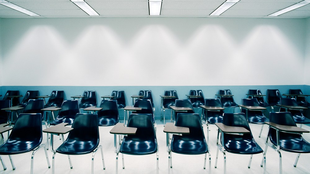 Desks in a classroom. (Photo by Bob O'Connor/Gallery Stock)