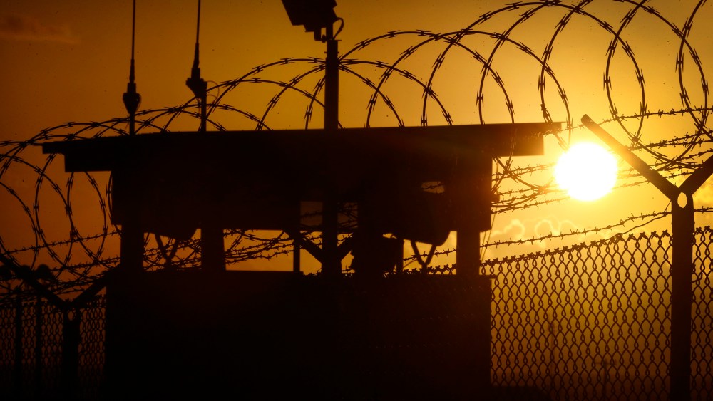 In this photo reviewed by the U.S. military, the sun rises above Camp Delta at Guantanamo Bay Naval Base, Cuba, Wednesday, Nov. 20, 2013.