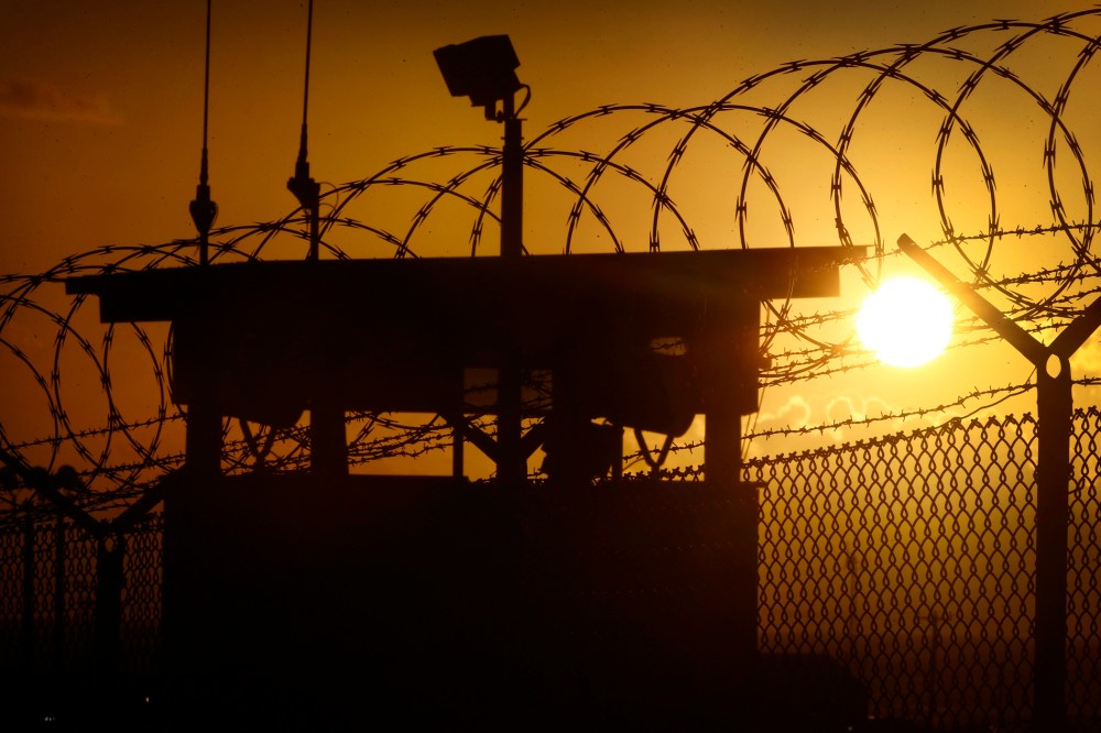 In this photo reviewed by the U.S. military, the sun rises above Camp Delta at Guantanamo Bay Naval Base, Cuba, Wednesday, Nov. 20, 2013.
