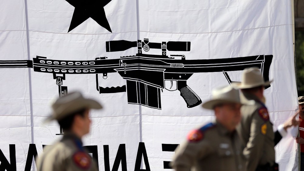 Texas State Troopers watch over a rally in support of open carry gun laws at the Capitol, on Jan. 26, 2015, in Austin, Texas.