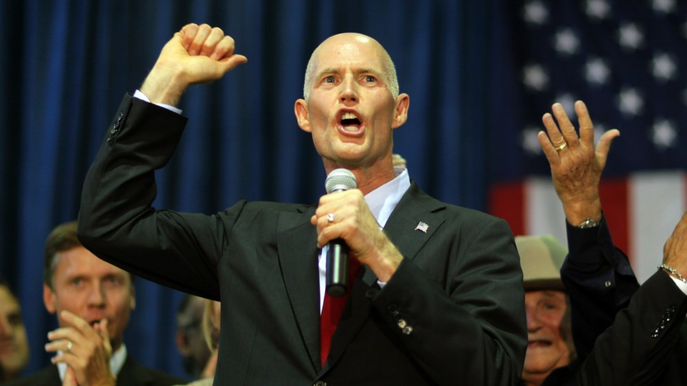 File Photo: Rick Scott, the Republican candidate for governor of Florida, as he campaigns at the Sweetwater Youth Center on August 31, 2010 in Sweetwater, Florida.  (Photo by Joe Raedle/Getty Images/File)