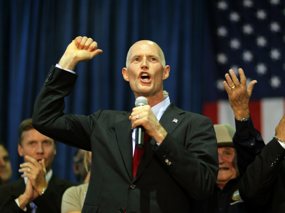 File Photo: Rick Scott, the Republican candidate for governor of Florida, as he campaigns at the Sweetwater Youth Center on August 31, 2010 in Sweetwater, Florida. (Photo by Joe Raedle/Getty Images/File)