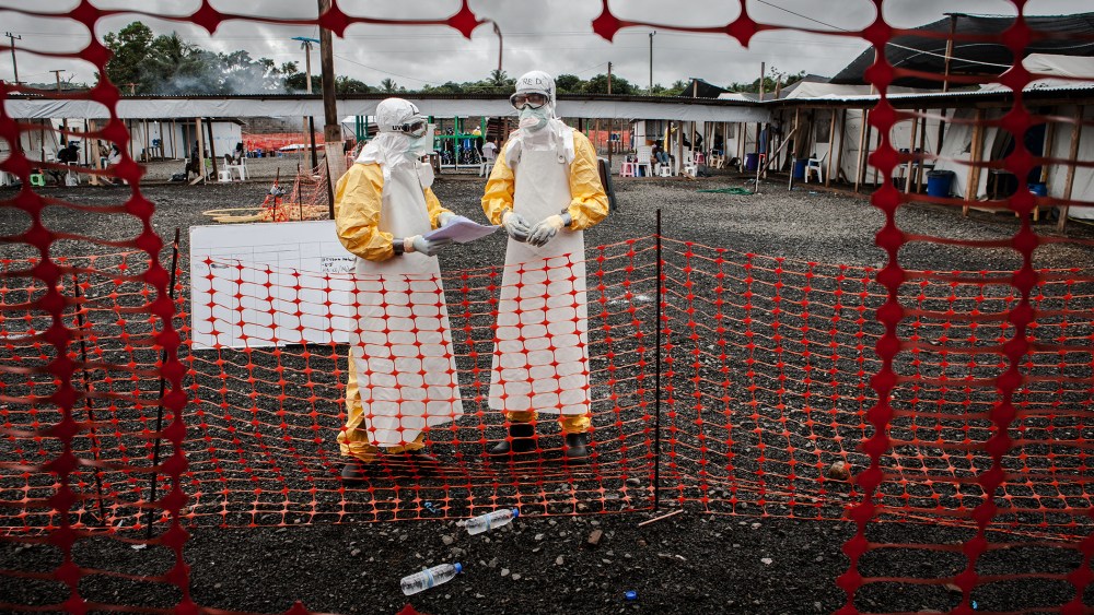 Doctors inside the high-risk area of the the Ebola Treatment Unit of Doctors without Borders in Monrovia, Liberia on Oct. 6th, 2014. (Photo by Daniel van Moll/Laif/Redux)