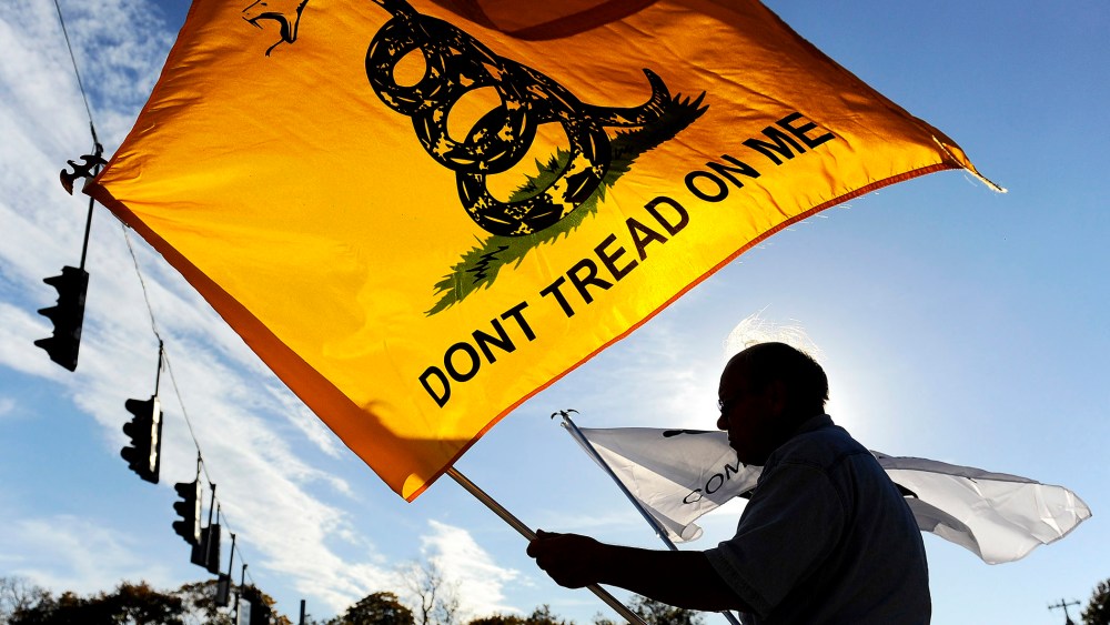 A man holds a flag during a Tea Party rally in New York on Oct. 28, 2010.