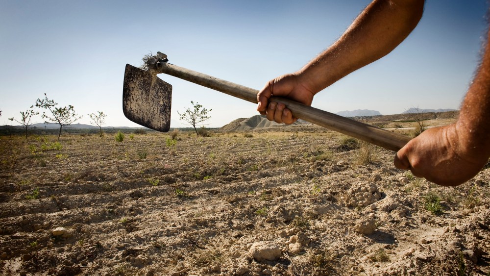 A farmer works his field in Albanilla, Spain.
