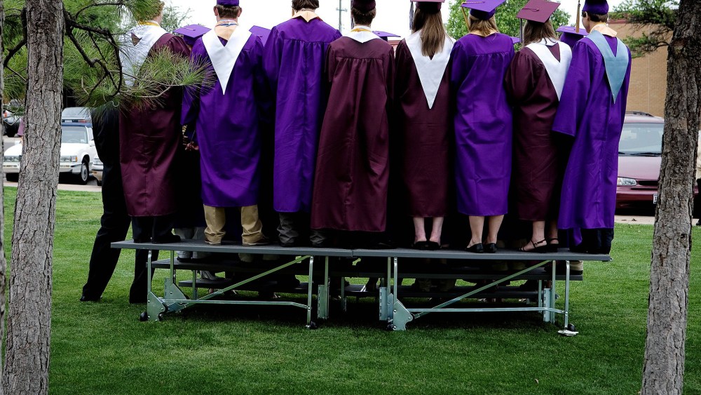 High school students at graduation.
