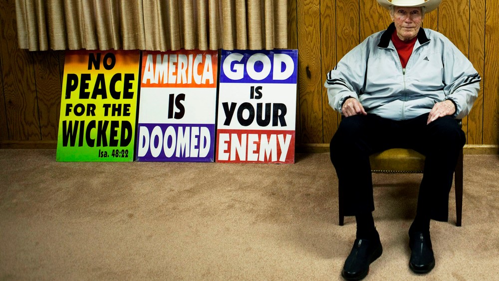 Fred W. Phelps Sr., of Westboro Baptist Church, pictured with picket signs at Westboro Church in Topeka, Kansas, Sept. 8, 2010.