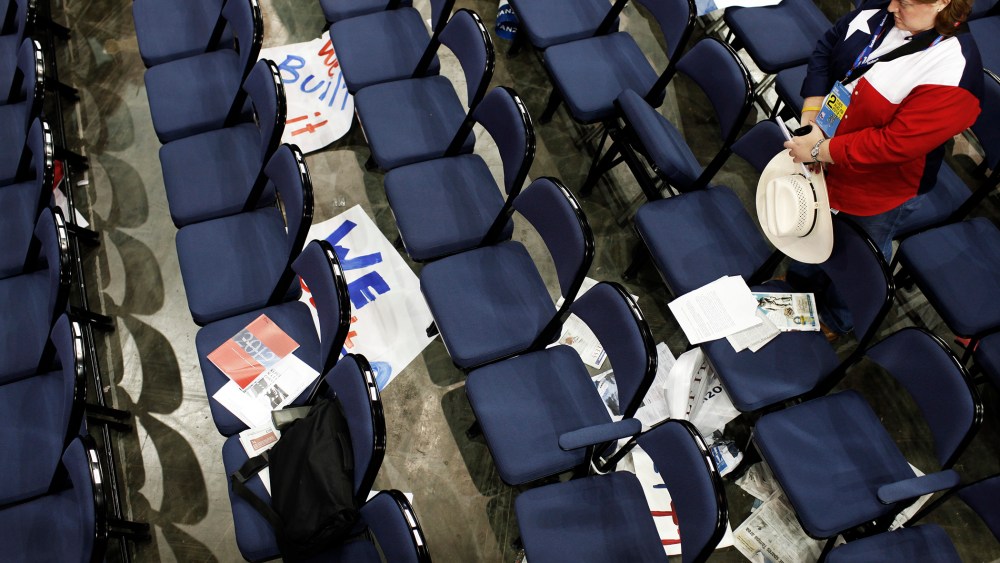 A delegate from Texas prays during the Republican National Convention.