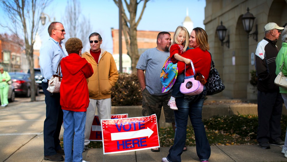 Voters line up at the Board of Elections office to cast their early ballots in New Philadelphia, Ohio, Oct. 26, 2012.