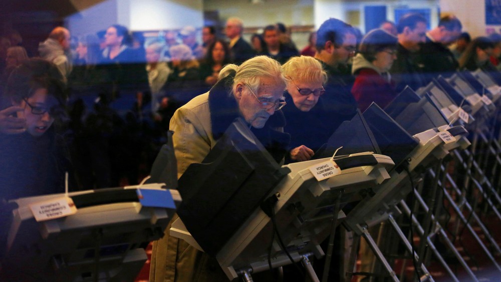 Voters cast ballots inside a polling station at Cross Community Church in Elyria, Ohio, on Election Day, Nov. 6, 2012.
