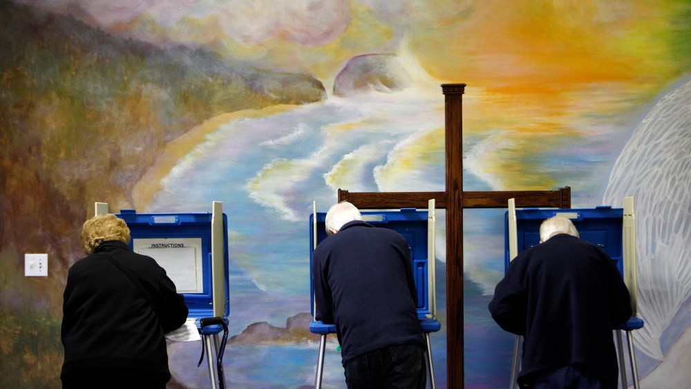 Voters cast ballots at the Fellowship of Christ church in Cary, N.C.