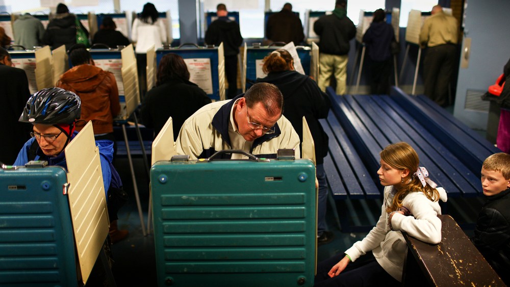 Randy Szerszen brings his two children, Grace and Luke, to a polling station in Cleveland, Ohio, on Election Day, Nov. 6, 2012. (Photo by Michael F. McElroy/The New York Times/Redux)