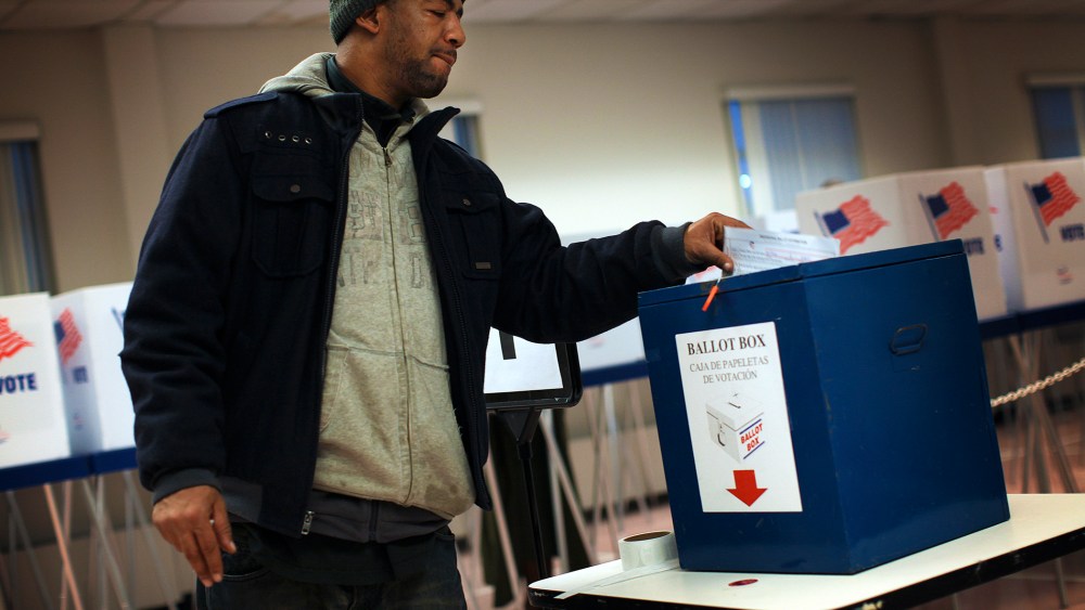 A voter drops off a provisional ballot at the Board of Elections in downtown Cleveland.