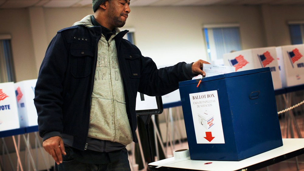 A voter drops off a provisional ballot at the Board of Elections in downtown Cleveland, on Election Day Nov. 6, 2012.