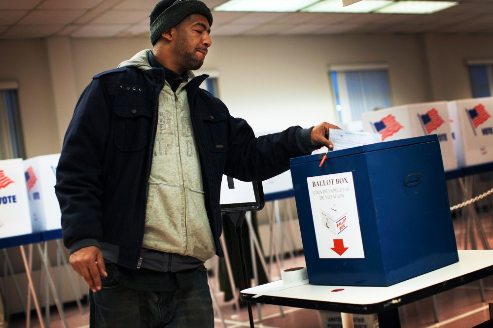 A voter drops off a provisional ballot at the Board of Elections in downtown Cleveland, on Election Day Nov. 6, 2012.