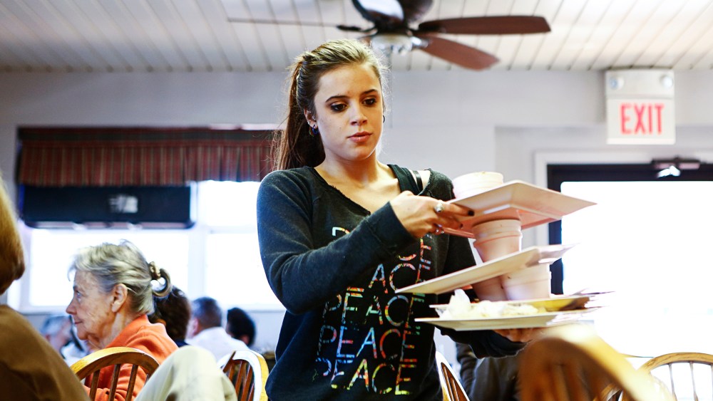 Taylor McCallister works at at Hick's barbeque restaurant in Belleville, Ill.