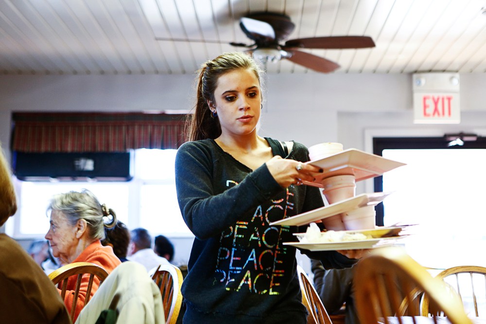 Taylor McCallister works at at Hick's barbeque restaurant in Belleville, Ill.