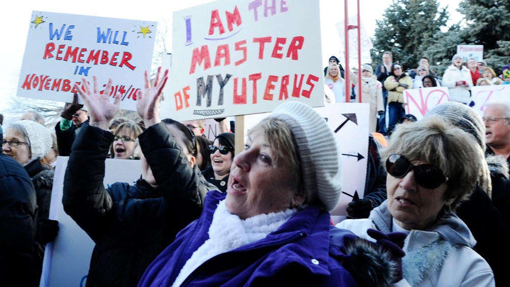 Abortion-rights advocates demonstrate during a rally outside a civic center in Fargo, N.D.
