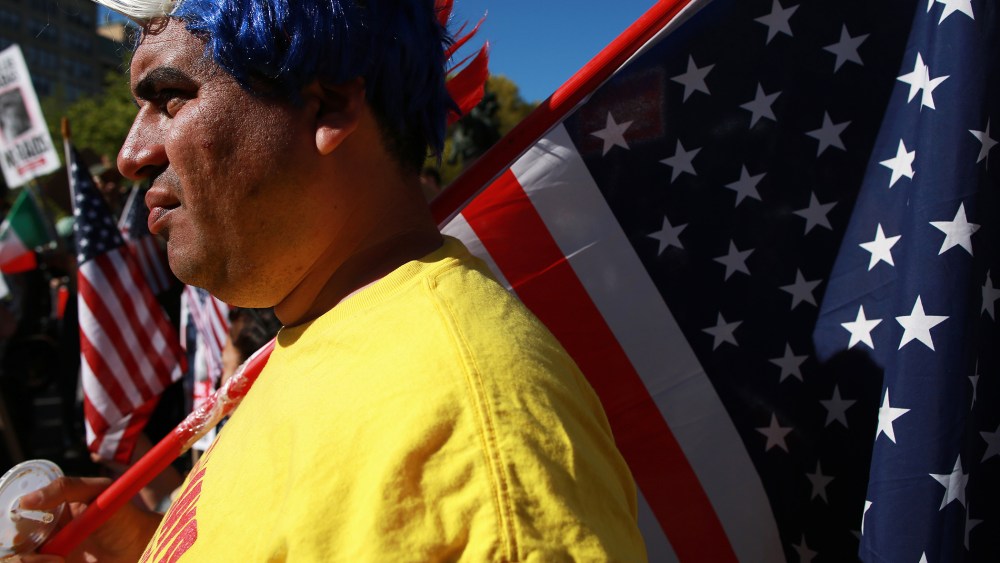 A protestor wearing a red, white and blue mohawk wig, rallies with civil liberties, immigrant rights and equality groups that attended a May Day protest at in New York City on May 1, 2013.
