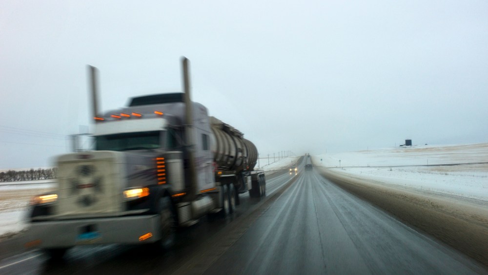 An oil tanker drives down a road near Watford City, North Dakota.