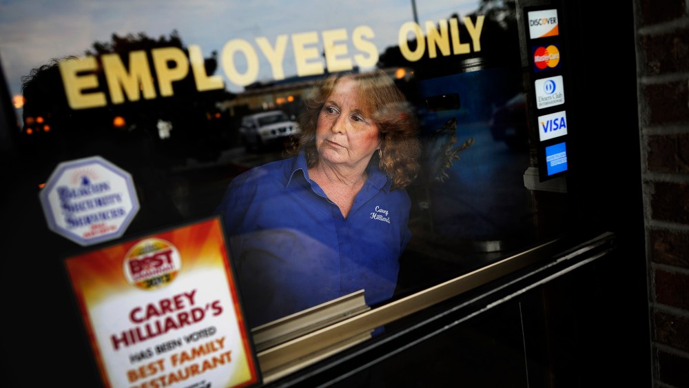 A waitress looks outside in Savannah, Ga., Oct. 28, 2013.