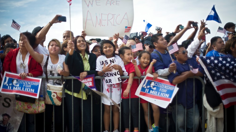 Immigration reform supporters cheer at a rally on the National Mall in Washington, Oct. 8, 2013.