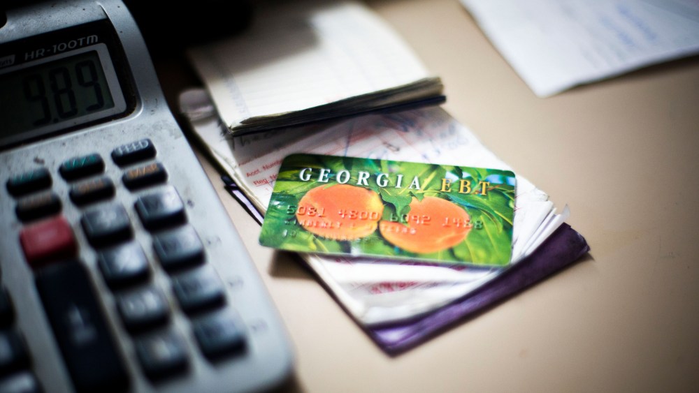 An electronic benefit card for Georgia's food stamp program sits on the counter of Shinholster Grocery & Meat in Irwinton, Ga., Nov. 21, 2013.