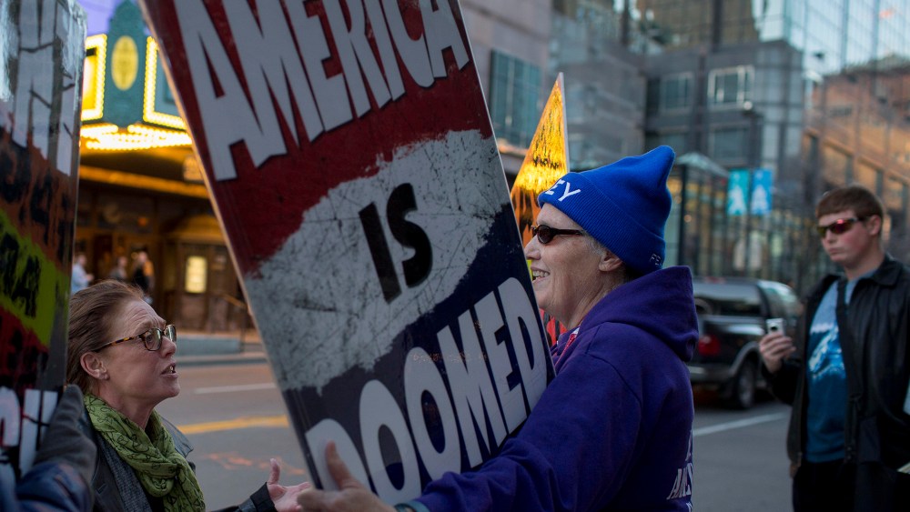 Barbara Moore, left, questions Westboro Church Member Shirley Phelps-Roper during a protest outside a Young the Giant concert at The Midland, Kansas City, Mo., March 19, 2014.