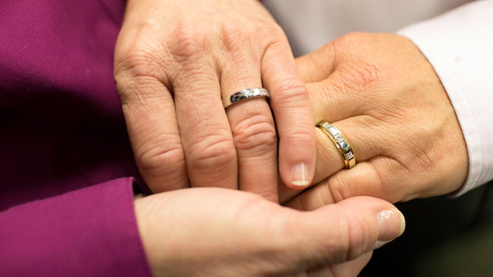 Jonnie Terry joins hands with her partner of 28 years, Elizabeth Patten, during their marriage ceremony at the Washtenaw County Clerk's Office in Ann Arbor, Mich., March 22, 2014.